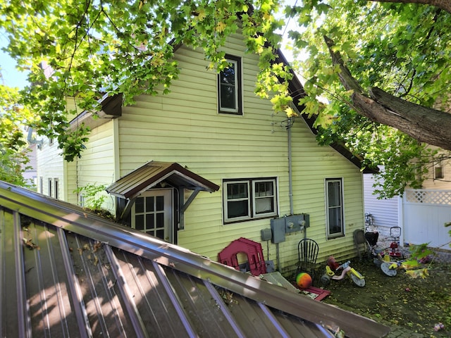 back of house featuring a wooden deck