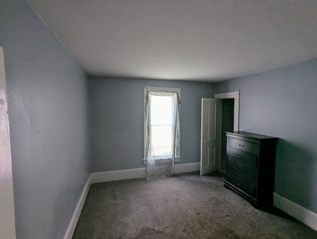 empty room with carpet flooring