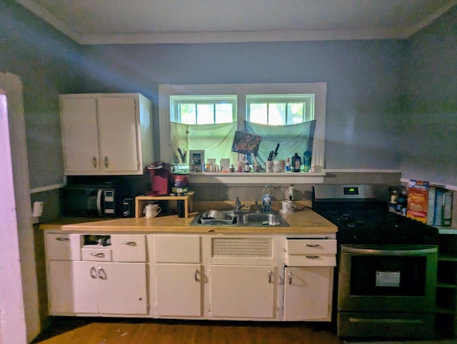 kitchen with white cabinetry, sink, dark hardwood / wood-style flooring, black / electric stove, and ornamental molding