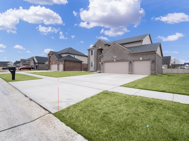 view of front of property with a garage and a front lawn