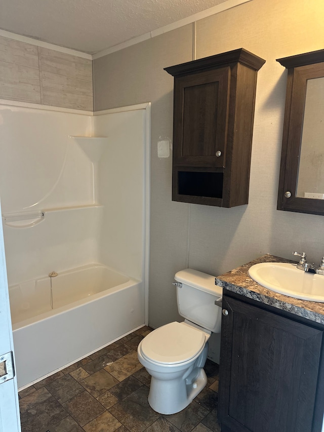 full bathroom featuring shower / washtub combination, vanity, a textured ceiling, and toilet