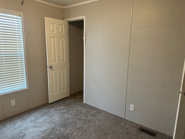 unfurnished bedroom featuring carpet