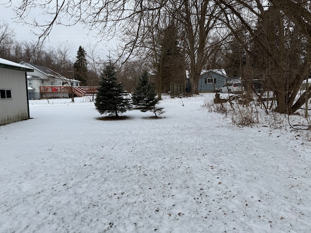 view of yard layered in snow