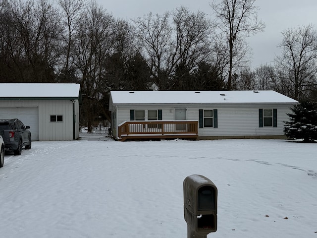 view of front of house featuring an outdoor structure and a garage