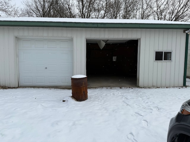 view of snow covered garage