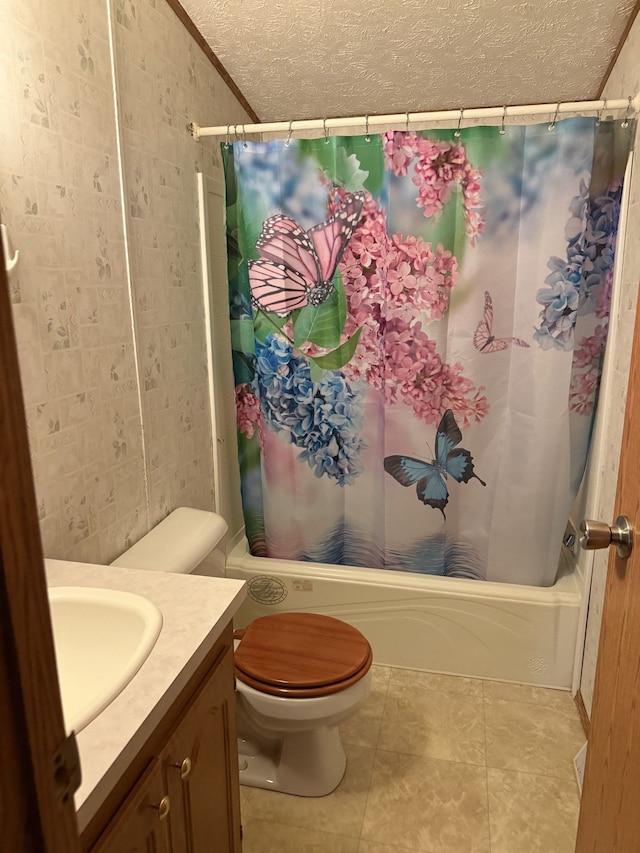 full bathroom featuring vanity, vaulted ceiling, toilet, a textured ceiling, and shower / tub combo with curtain