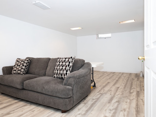 living room with light hardwood / wood-style flooring