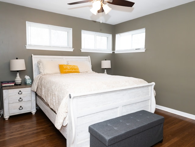 bedroom with ceiling fan and dark hardwood / wood-style floors