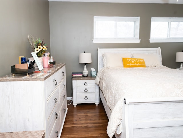 bedroom featuring dark wood-type flooring