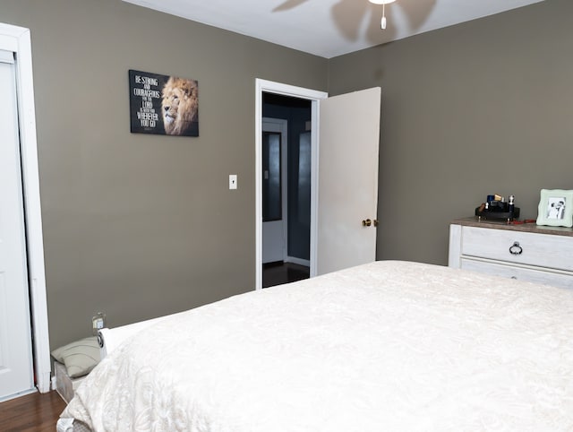 bedroom featuring ceiling fan and dark wood-type flooring