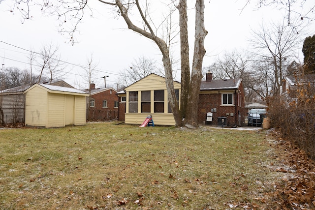 back of house with a yard