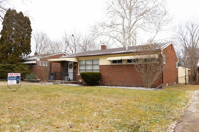 ranch-style house with a front lawn