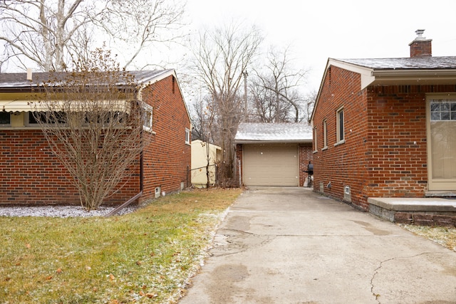 view of property exterior with an outbuilding and a garage