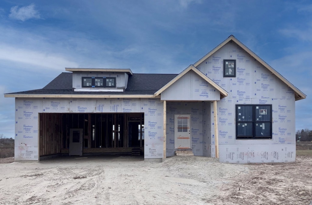 property in mid-construction with a garage