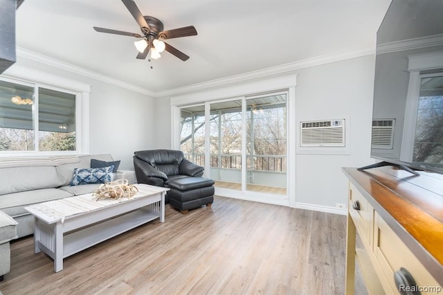 living room featuring a wall mounted air conditioner, plenty of natural light, and ornamental molding