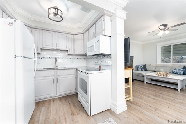 kitchen featuring white appliances, ceiling fan, sink, white cabinets, and light hardwood / wood-style floors