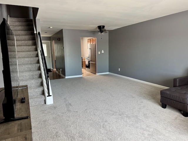 125 Cuttle Rd Unit B8, Marysville, MI 48040 - unfurnished living room with ceiling fan, baseboards, stairs, and carpet floors