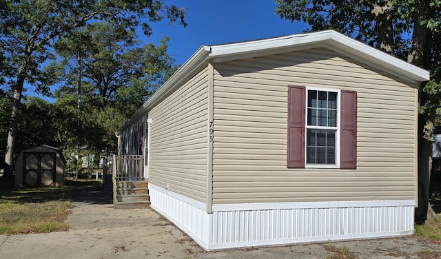 view of side of property with a shed