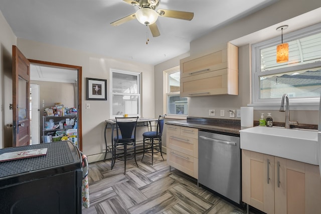 kitchen with a baseboard heating unit, hanging light fixtures, sink, stainless steel dishwasher, and light brown cabinetry