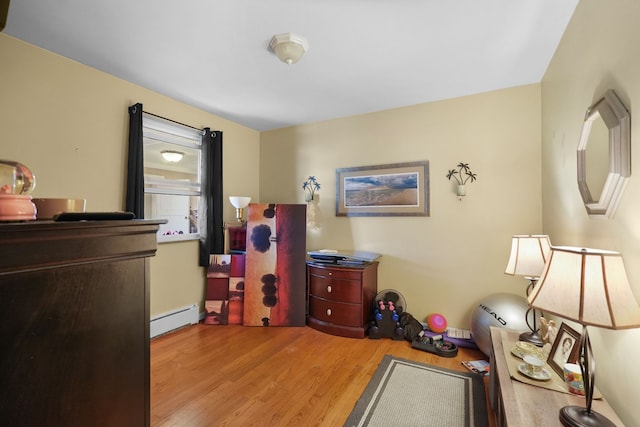 interior space featuring light hardwood / wood-style flooring and a baseboard heating unit