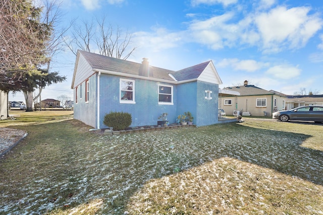 view of home's exterior with a lawn