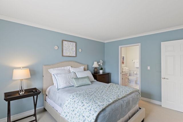 bedroom featuring light carpet, ensuite bathroom, and ornamental molding