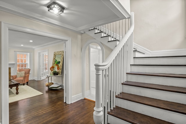 stairs with crown molding, wood-type flooring, and pool table