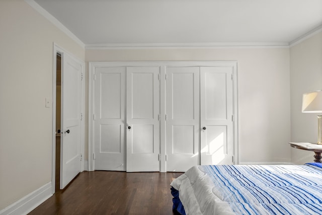 bedroom with dark hardwood / wood-style flooring and crown molding