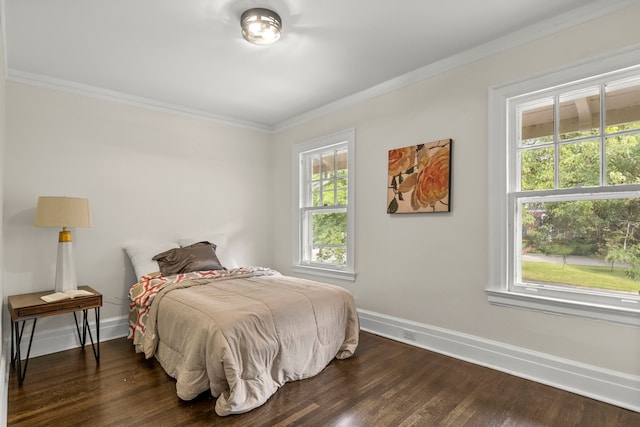 bedroom featuring dark wood-type flooring and ornamental molding