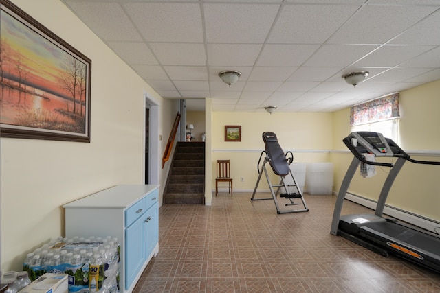 workout area featuring a drop ceiling