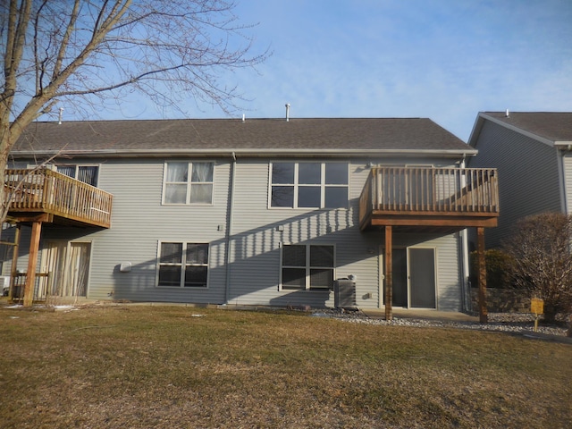 rear view of property with a yard