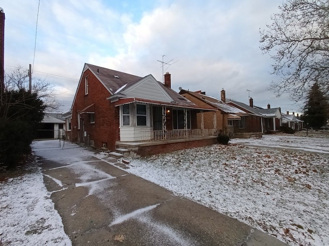 view of front of house with a garage and an outdoor structure