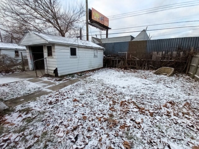 snowy yard with an outdoor structure