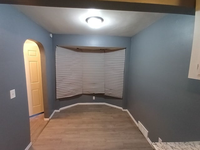 empty room with wood-type flooring