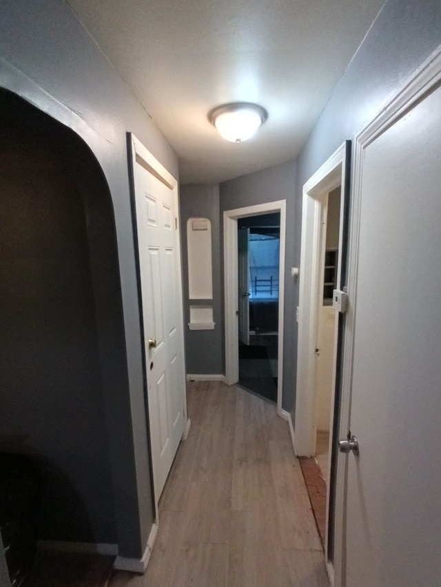 hallway with light wood-type flooring