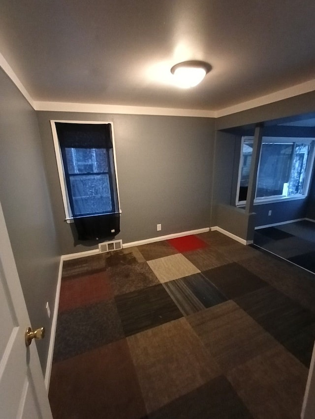 interior space featuring dark carpet