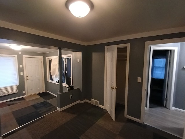 foyer featuring dark hardwood / wood-style floors