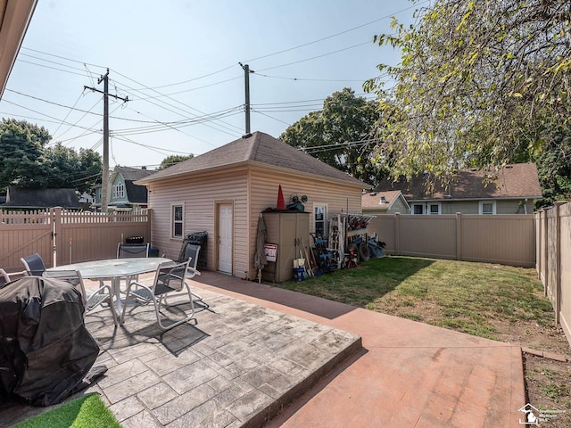 view of patio / terrace with an outbuilding