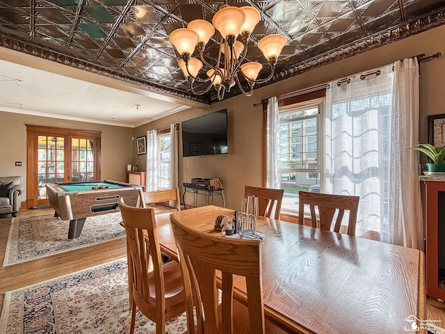 playroom with hardwood / wood-style flooring, crown molding, a chandelier, and pool table