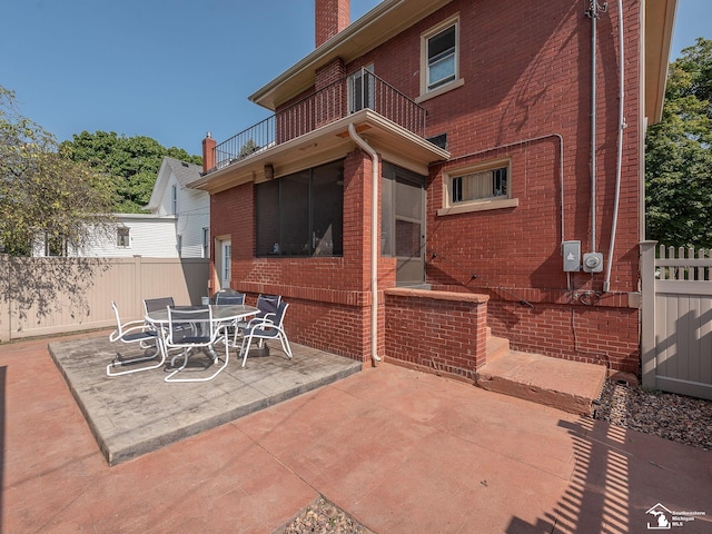 view of patio with a balcony