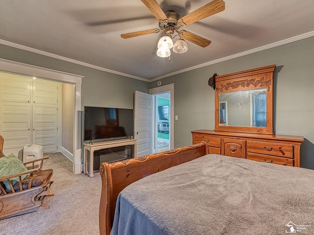 bedroom with ceiling fan, crown molding, and light carpet