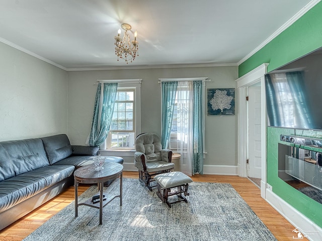 living room with wood-type flooring and ornamental molding