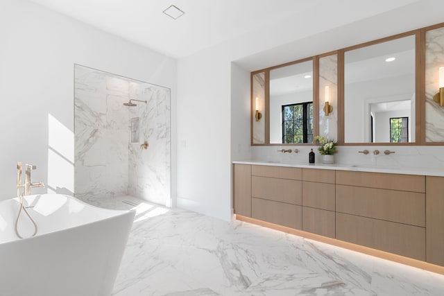 bathroom with vanity and independent shower and bath