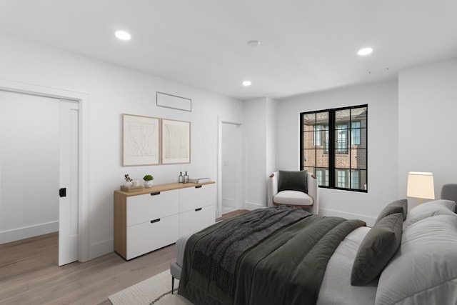 bedroom featuring light wood-type flooring