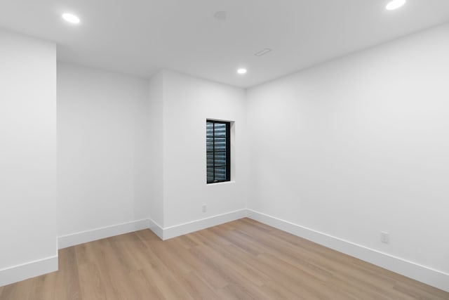 spare room featuring light hardwood / wood-style floors