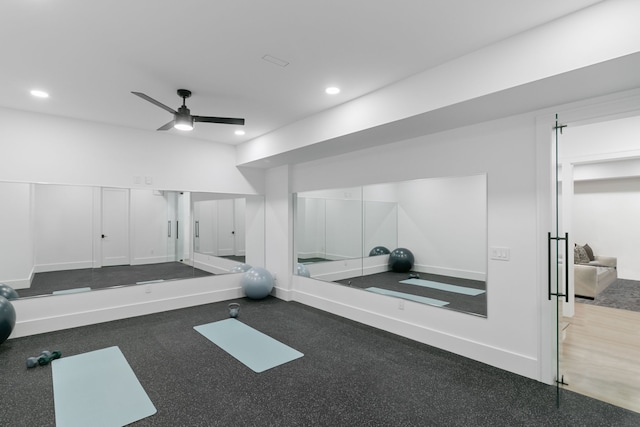 exercise room with ceiling fan