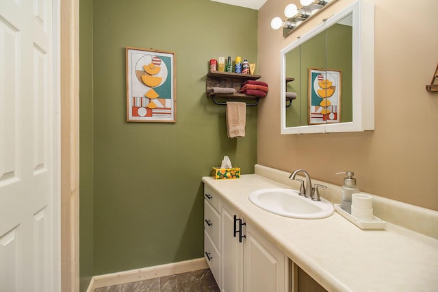 bathroom featuring tile patterned flooring and vanity