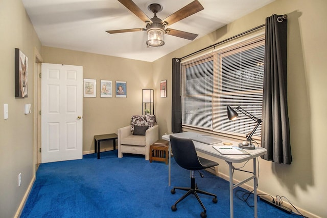 office featuring dark carpet and ceiling fan