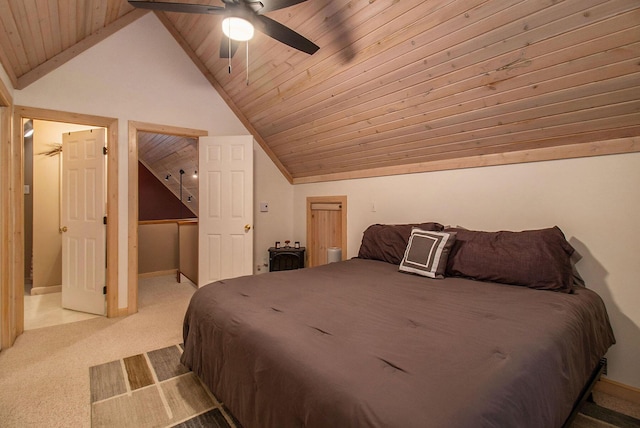 bedroom featuring vaulted ceiling, wooden ceiling, ceiling fan, and carpet