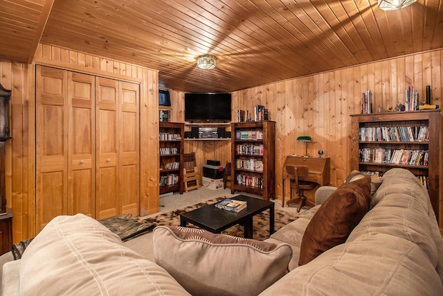 carpeted living room featuring wooden ceiling and wood walls